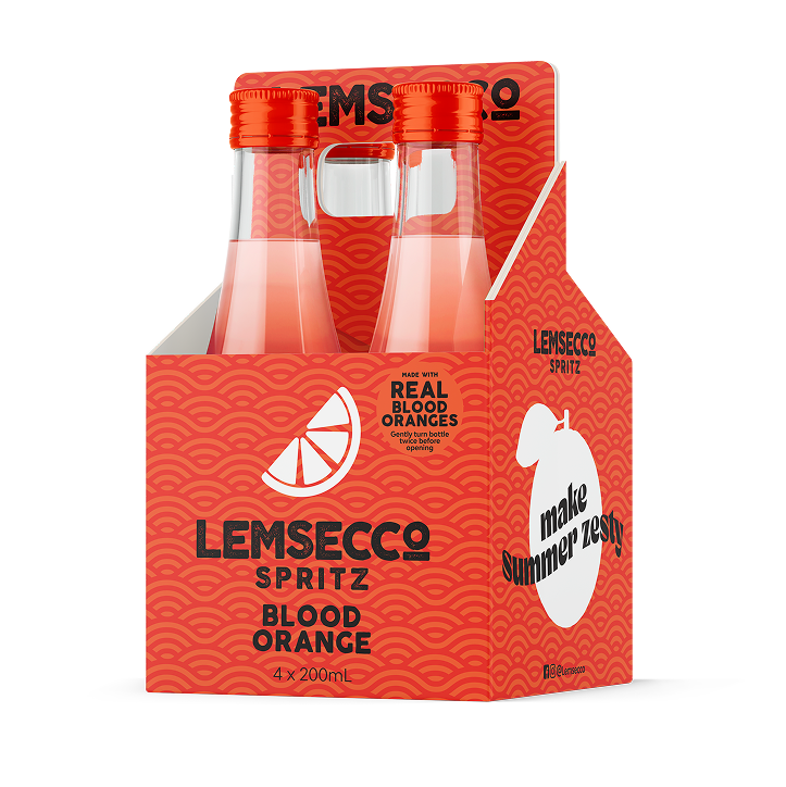 Lemsecco Blood Orange Spritz Minis: four clear glass mini bottles with orange caps in a bright red carrier featuring citrus graphics and "real blood oranges" text—an ideal, zesty summer treat for prosecco lovers.